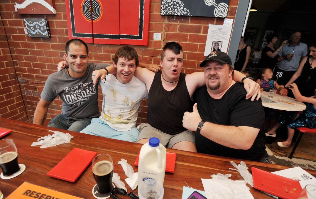 Rodney Reberger, Kyle Betkowski, Jackson Price Maxwell and Craig Maxwell at the Fire in the Hole pizza eating contest at The Thirsty Crow on Saturday night. Picture: Alastair Brook