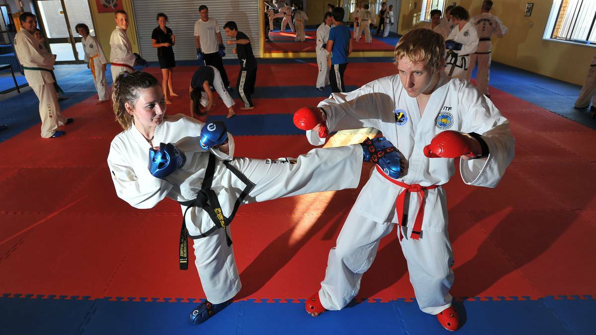Kaitlin Jeffries, 15, and Cameron Graham, 16, train for the 2013 AAITF National Taekwondo Championships, which were hosted in Wagga for the first time this year. Picture: Riverina Leader