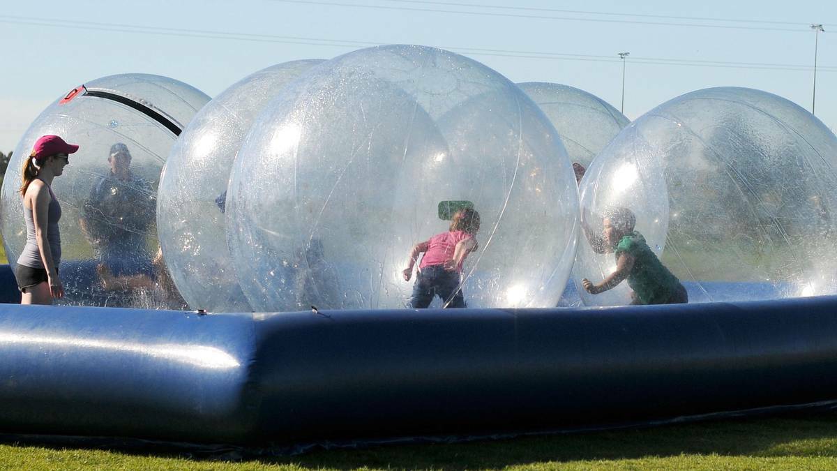 Youngsters make the most of the zorbing balls at the Wagga Christian College. Picture: Riverina Leader