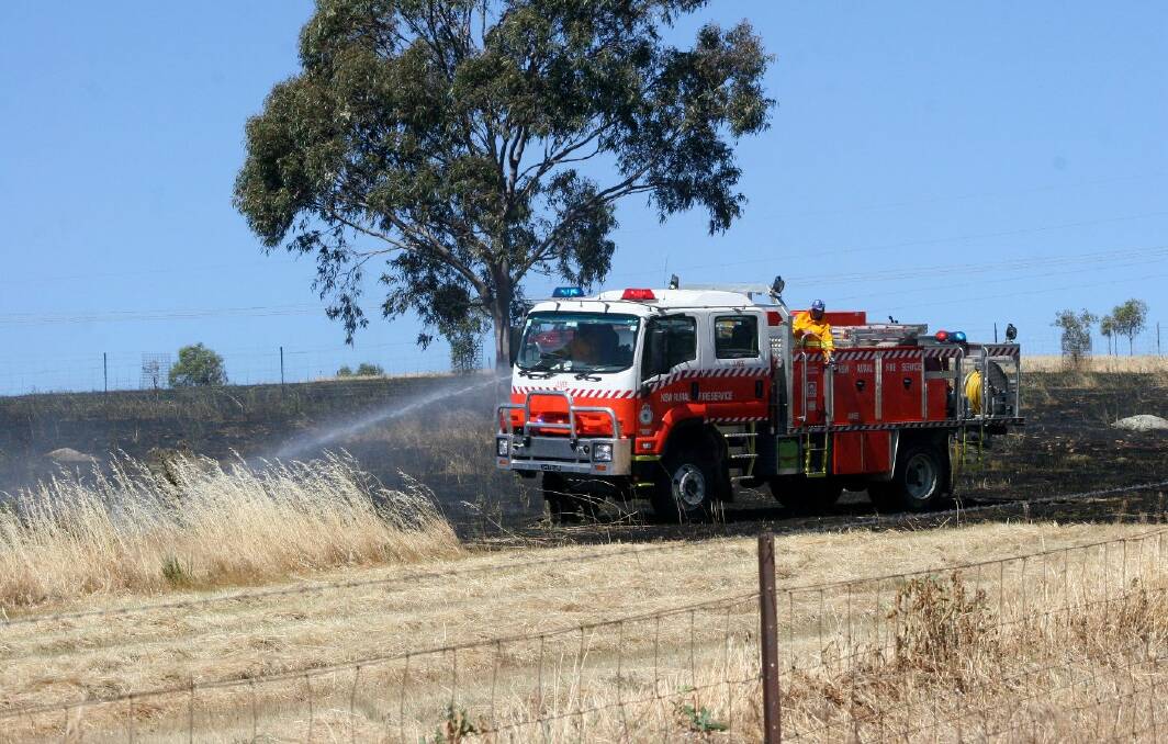 A grass fire broke out in a paddock near Waterworks Road in Junee on Monday. Picture: Declan Rurenga