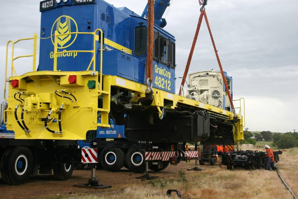 Refurbished bogies are rolled back under the locomotive. Picture: Declan Rurenga