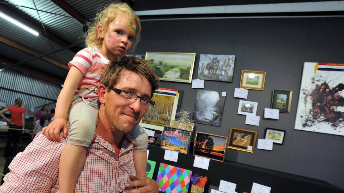 Illabo Show - Anthony Duck gives two-year-old daughter Olivia a boost. Picture: Les Smith