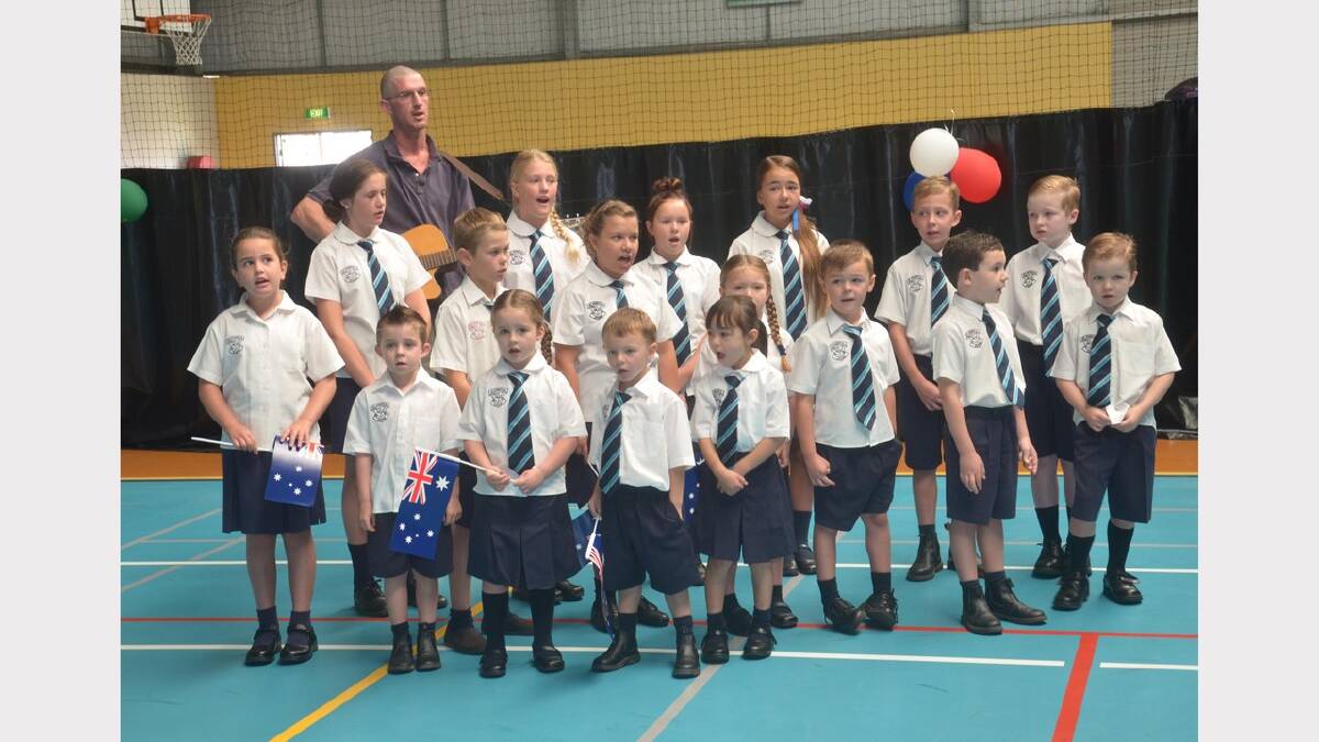 St Joseph's Primary students sing the national anthem. Picture: Declan Rurenga