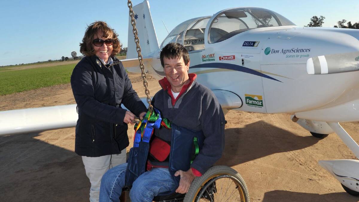 NEW HEIGHTS: Farmer Sam Bailey prepares for a quick flight over the district last week when he and his wife Jenny stopped by Eurongilly to inspire and share his incredible story with school children and the community. Picture: Michael Frogley