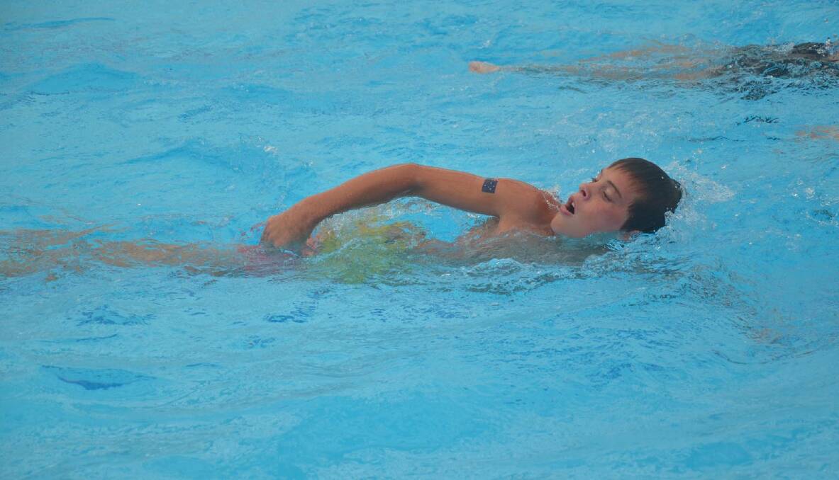 Tim Chapman, 12 during the swim leg on the mini triathlon. Picture: Declan Rurenga