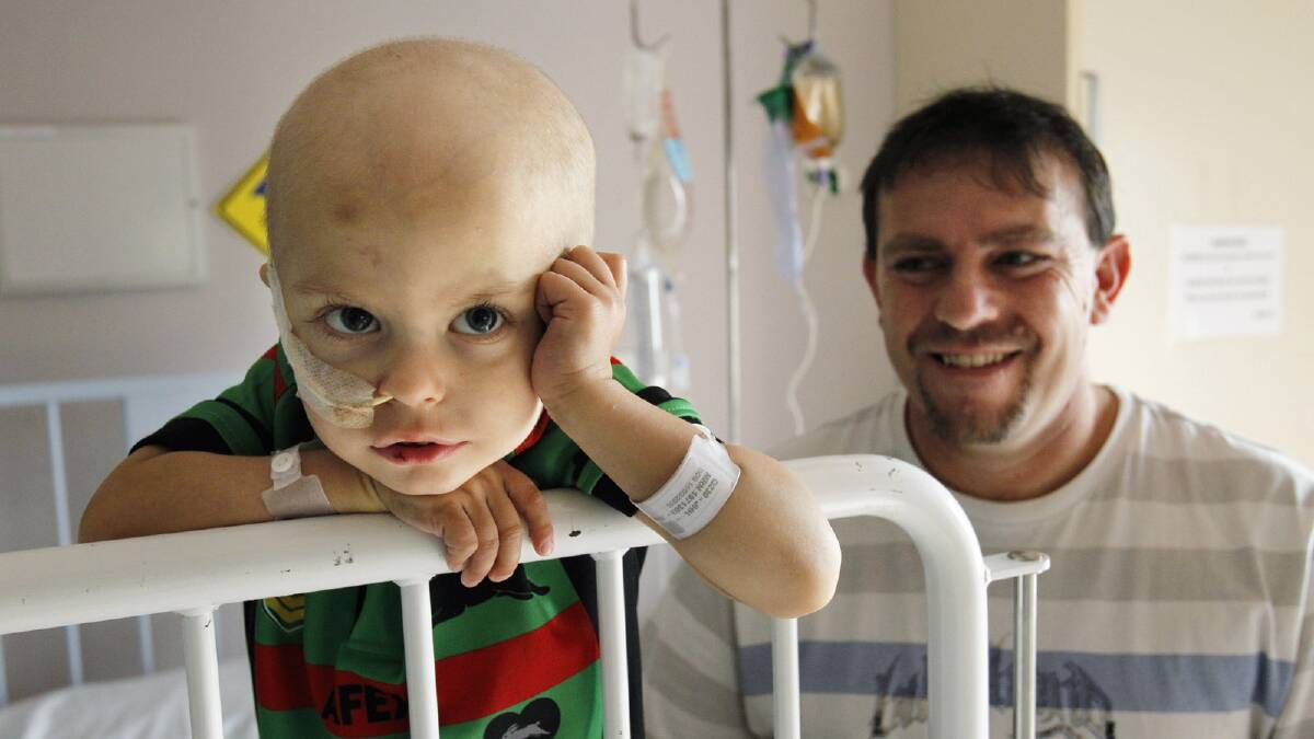 TOUGH ROAD: In the John Hunter Hospital in Newcastle for his cancer treatment, Bailon (right) and Randy Johnson can still share a smile. Picture: Newcastle Herald