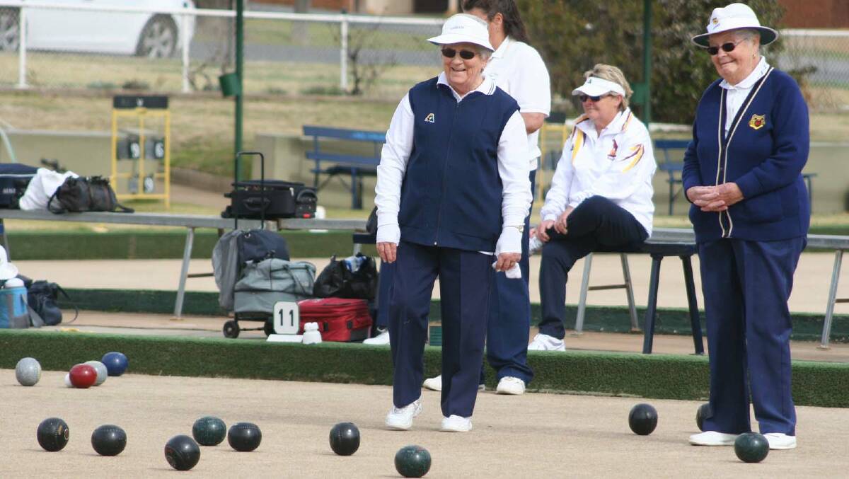 Skips Natalie Kember (Ganmain, left) and Faye Quine (Junee Bowling) watch the bowls roll.