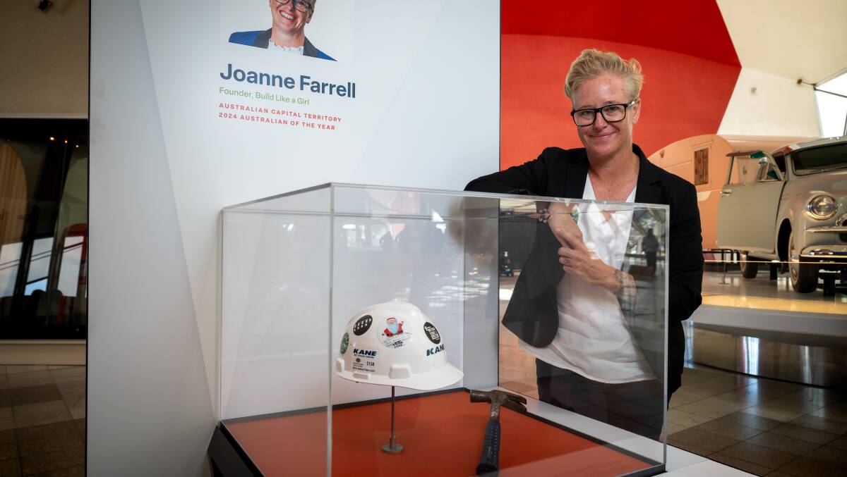 ACT Australian of the year Joanne Farrell, with her items, a hard hat and hammer at the National Museum of Australia. Picture by Elesa Kurtz.