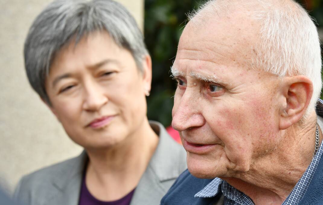 WAITING GAME: Wynyard pensioner Brian Tipler talks about how long he has been waiting for NAB to give his money back, while Opposition Senate Leader Penny Wong listens. Picture: Brodie Weeding