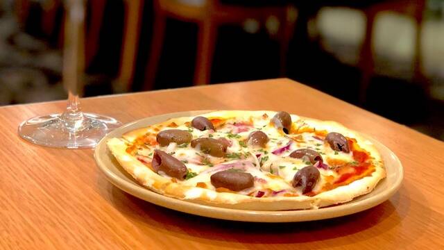 Baume's delicious tasting pizza is perfect with a glass of burgundy. 