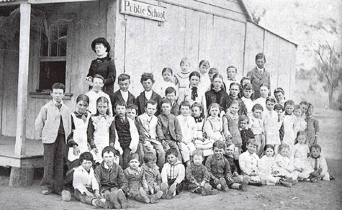 SCHOOL'S IN SESSION: Teacher Lillian Crawley with the students at Junee's first public school in 1881. Picture: Contributed 