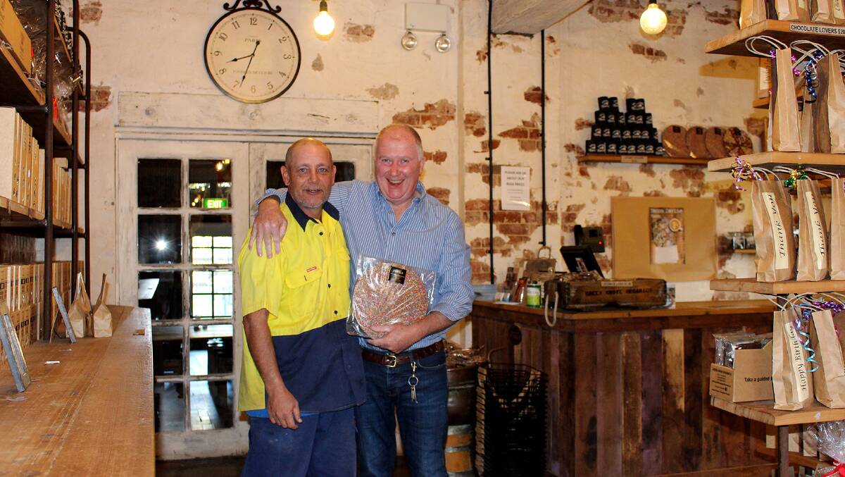 SUCCESS: Waide Hook with his new employer, Junee Licorice and Chocolate Factory general manager, Neil Druce. 