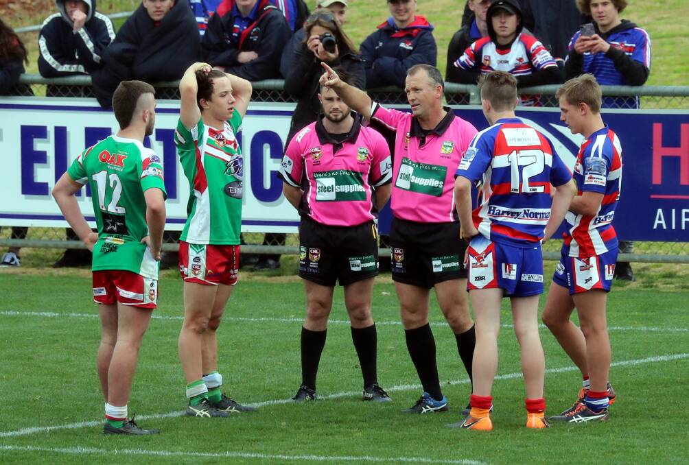 CHANGING TIMES: Referees talk to players from Brothers and Young in this year's under 16 Sullivan Cup grand final. Picture: Les Smith