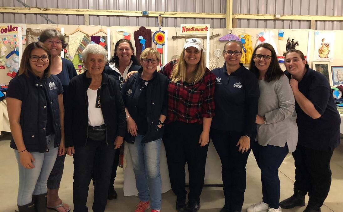 JUMPING IN: RAS staff helping out with the Arts and Crafts exhibit at Taree Show. There will be a cohort helping out at the 130th Junee Show as well.