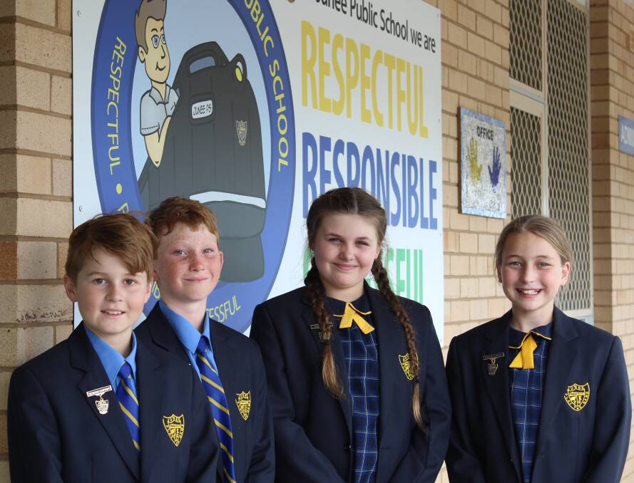 DEDICATED: Junee Public School captains Zachariah McDonald (left) and Katie Standford (right), with vice captains Flynn Wattie and Elyse Smallmon (centre).