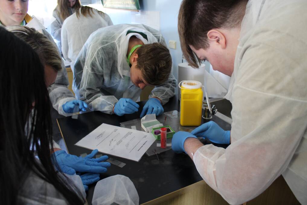 HANDS-ON: Students from all over the state engaged with bio-science workshops held at Junee High School on September 7. Picture: supplied.