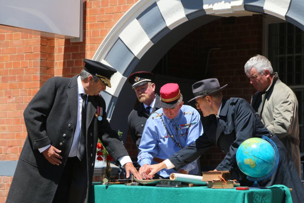MEMORY MOMENT: playing the Allied admiralty Bill Muller, Bob Callow, Peter Logan, and German representatives Neil Smith, and John Gibbons during Sunday's re-enactment of the signing of the armistice. Picture: Peter Neve OAM