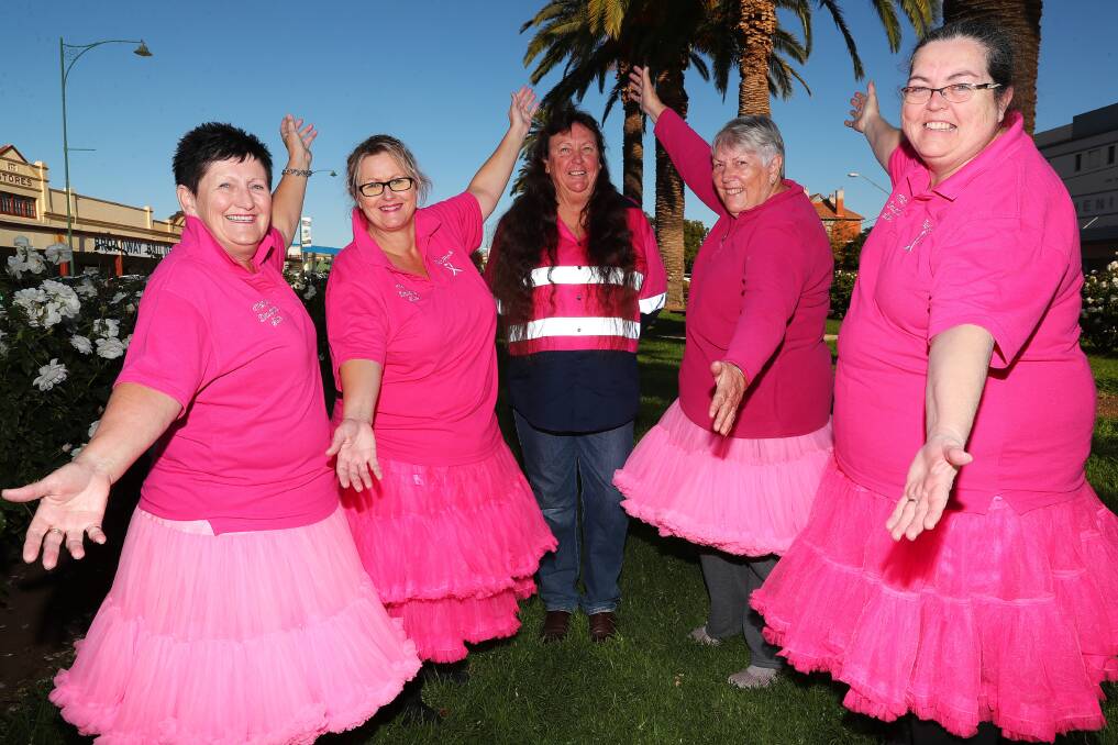 PRETTY IN PINK: Junee's Pink Ladies have staged an annual cancer fundraiser for more than a decade. Deb Heard at the centre, with Kerrie Holmes (far left), Sharon Jeffrey, Lorraine Kemp and Maree Wright (far right). Picture: Emma Hillier