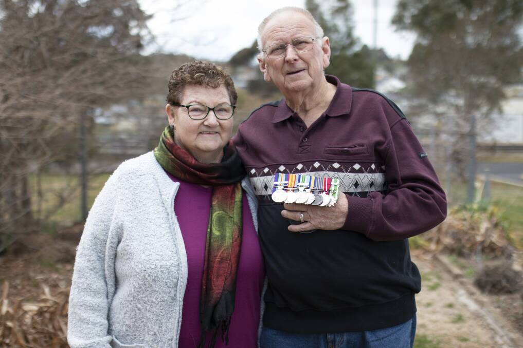 REMEMBERING VIETNAM: John and Barbara Curtis outside their Junee home, with medals commemorating from the family's enormous involvement in Australia's war history. Picture: Emma Horn