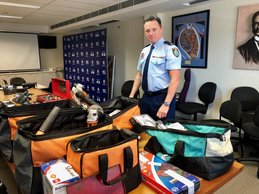 Riverina Police District's Detective Inspector Darren Cloake with items seized from a Turvey Park home. Picture:Toby Vue