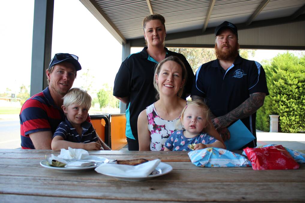 Damien Manson with Percy 3, and Skye with Florence 2, and Junee Bakery owners Tina and Jay. Picture: Emma Horn