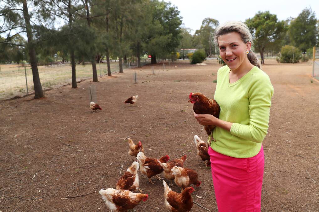 Anna Lashbrook with some of the 800 hens on the Old Junee farm. Picture: Emma Hillier