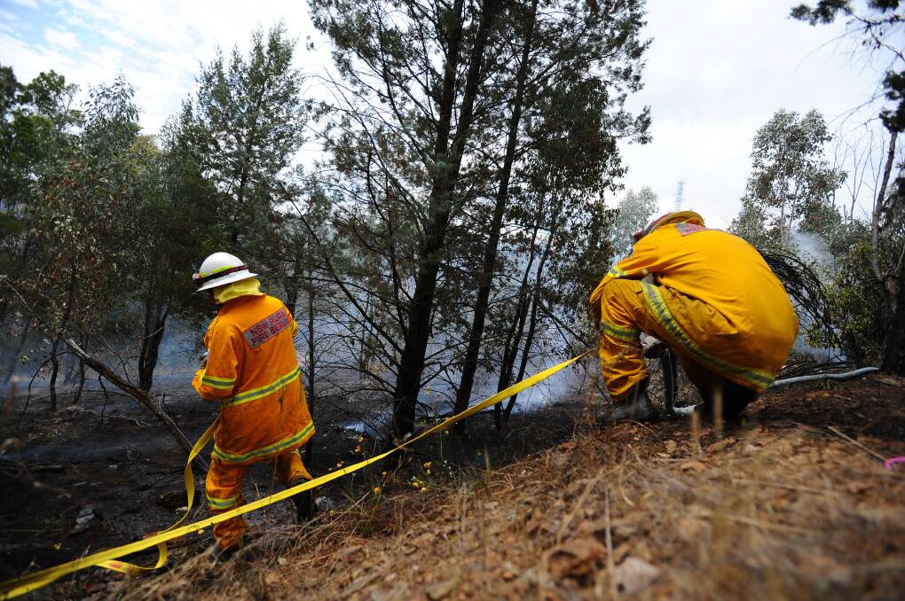 EMERGENCY RESPONSE: The Rural Fire Service responds to a bushfire on Wagga's Willans Hill in 2011. The state government will charge councils an increased emergency services levy from July 2019.