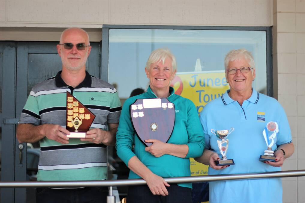 HIGH HONOURS: Band director Keith Griffin, choir master Fran Griffin, and long-term band member Jackie Starr with a few of the awards won at the Leeton Eisteddfod. 