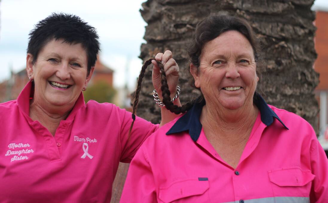 UP FOR THE CHOP: Kerrie Holmes holds Deb Heard's prized plait that will soon be turned into a cancer wig. Picture: Emma Horn 