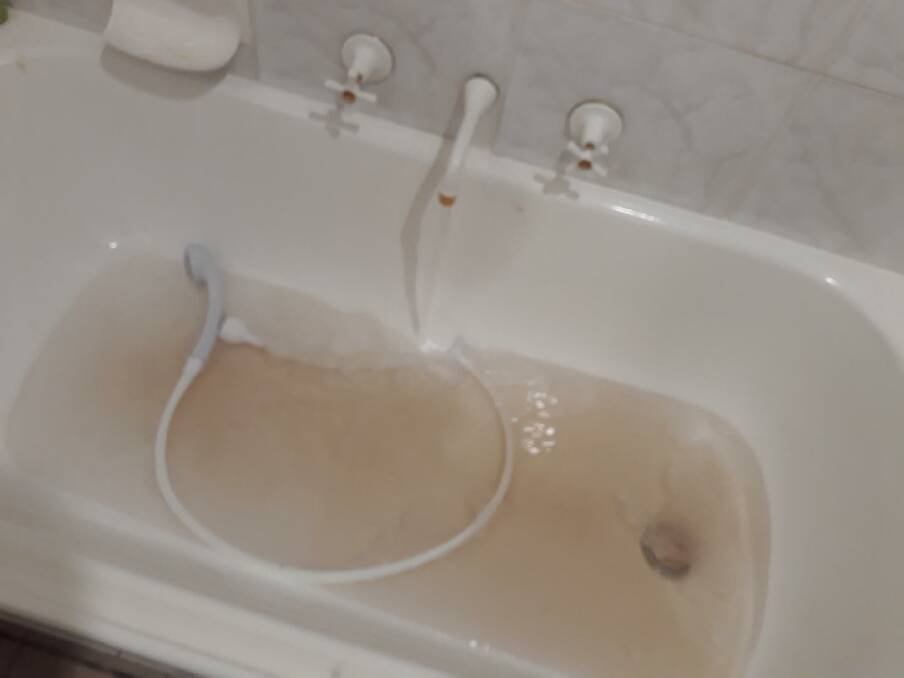 Discoloured water jetting through Debie Heritage's home pipes. Picture: supplied