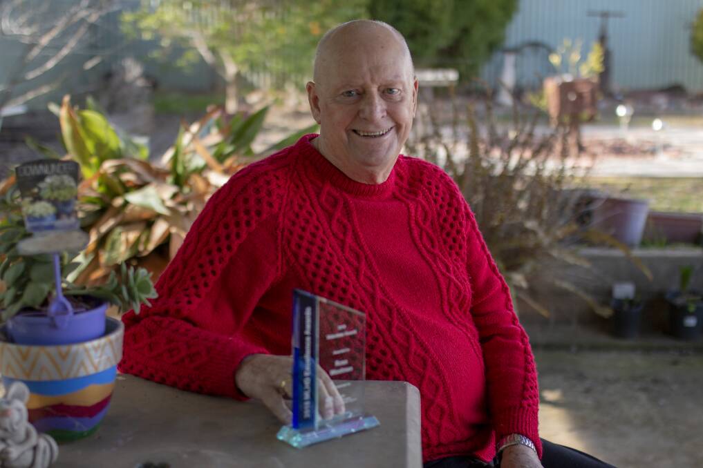 Ross Woolman with his MLHD Excellence Award at his home in Junee. Picture: Emma Horn