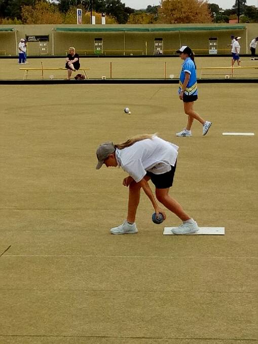 PERFECT TECHNIQUE: Katie Standford, 12, in action on the green in Wagga during the Zone 8 competition earlier this year. Picture: supplied