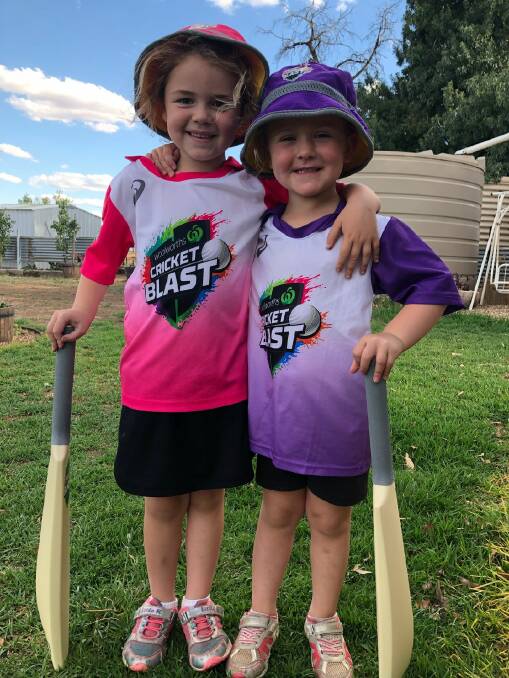 BIG BASH: Willow Carter 6, and Mahli Carter 5 in their Woolworths Cricket Blast uniforms at the Eurongilly oval. Picture: supplied