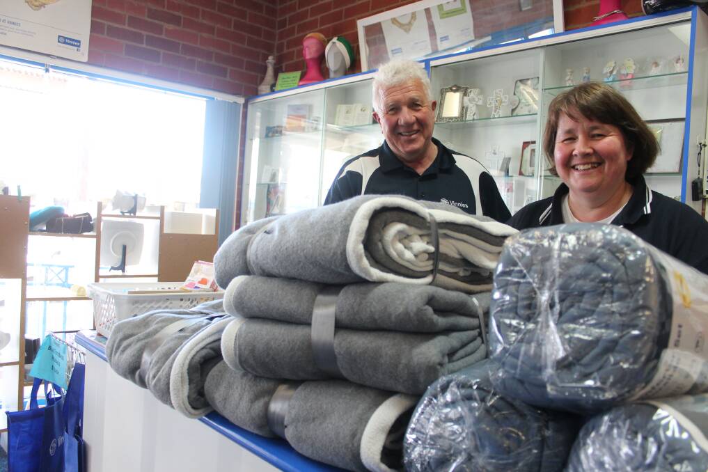 WINTER WARMTH: John Reeves with Nikki Cocks at Junee St Vincent de Paul following the delivery of $500-worth of blankets. Picture: Emma Horn
