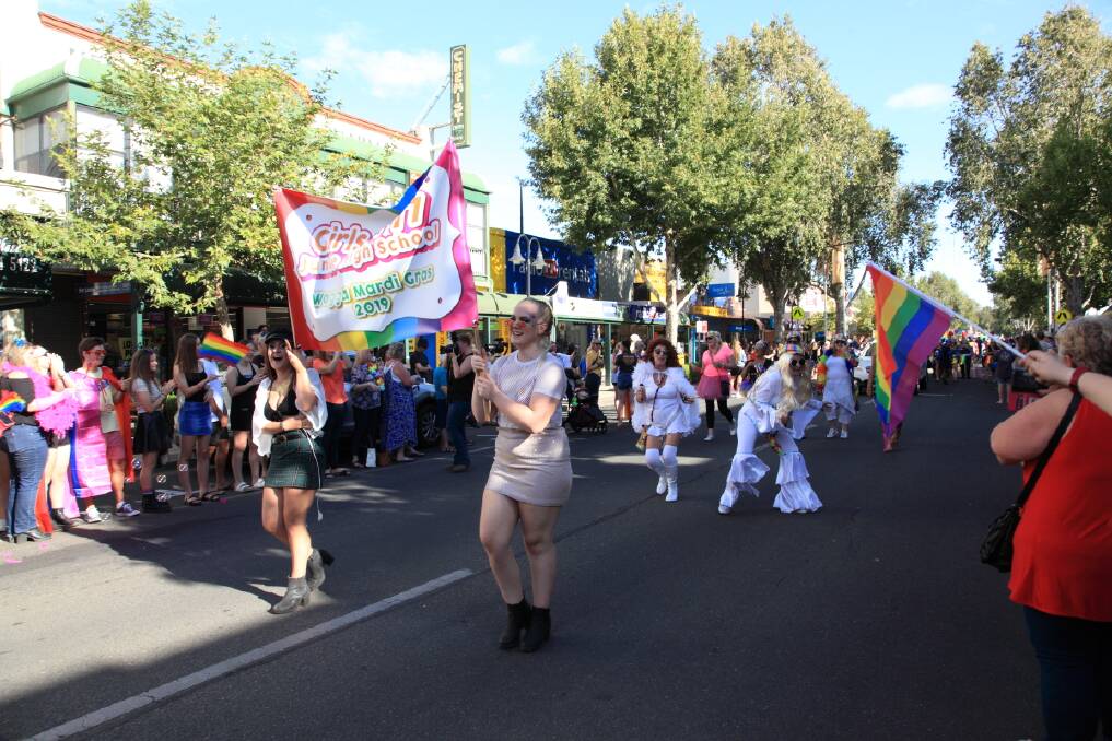 Former Junee High School pupils march in the parade. Picture: Tristan Levy