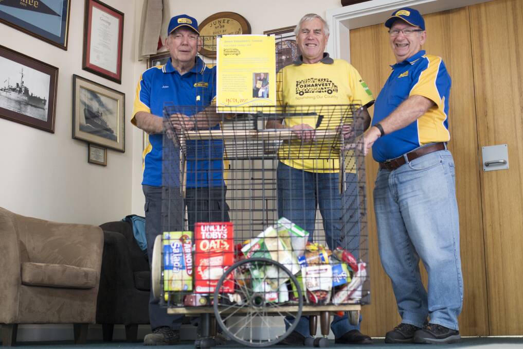 (From left) Junee Men's Shed coordinator John McLaren, OzHarvest's John Foord, and volunteer Loren West with the trolley at the Junee Shire Council Chambers. Picture: Emma Horn.