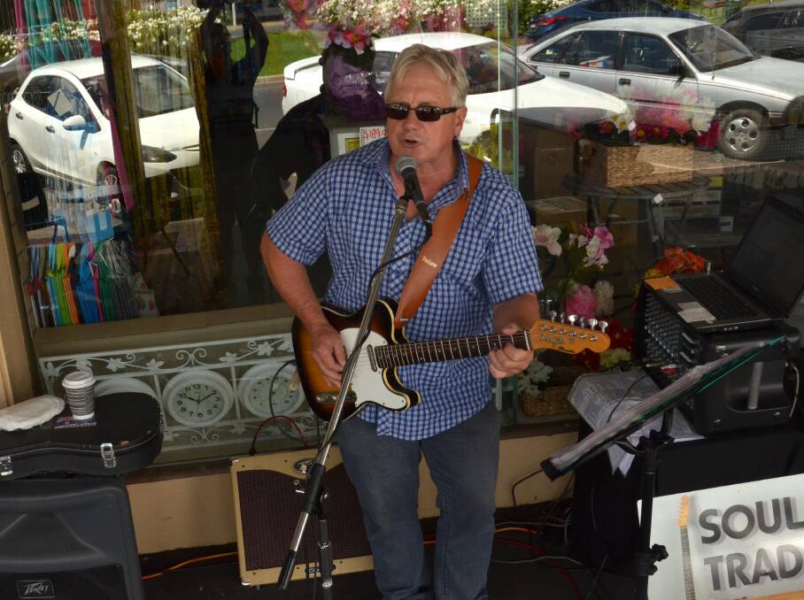 ​Peter Hartwig of Soul Trader busks on Broadway during the 2014 Rhythm'n'Rail festival.