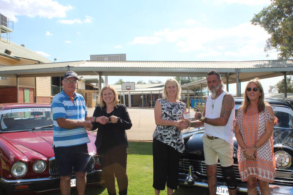 GENEROSITY: Junee Motor Club president Kevin Longmore, principals Tracy Delaney and Kay Thurston, and publicity officers Neil and Tracey Sims.