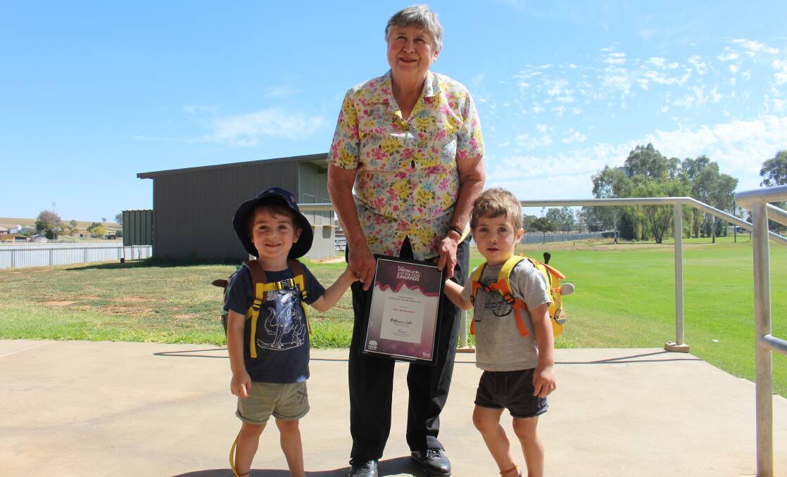 RECOGNISED: Councillor Pam Halliburton and her grandsons Noah and Xavier with Pam's Woman of the Year award for the Cootamundra electorate. 