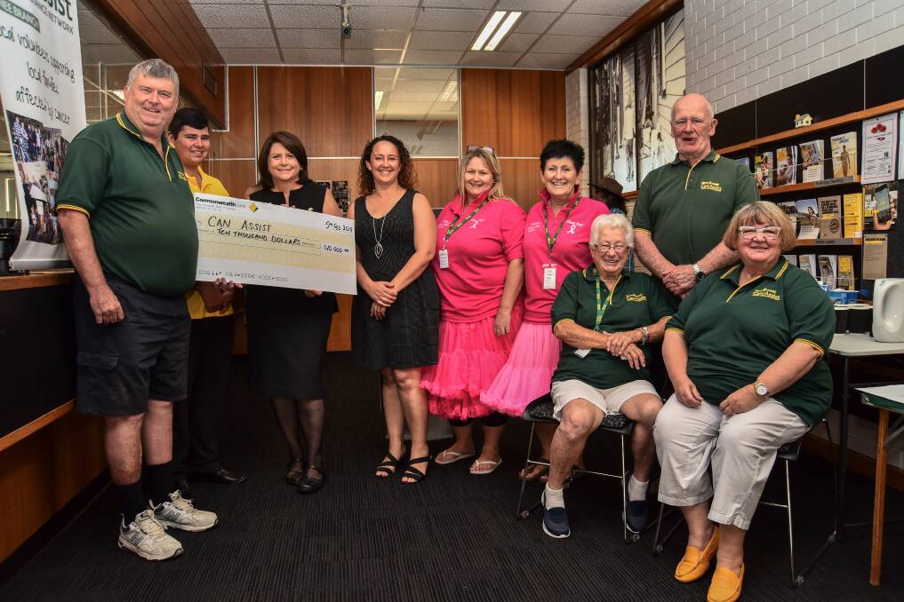 GENEROSITY: Graham Besley, Chris Judd, Yvonne Barzen, Natalie Phillips, Sharon Jeffrey, Kerrie Holmes, Maureen Fitzgerald, Peter Mack, and Heather Edwards as the Commonwealth Bank's presents its donation to Can Assist. Picture: Struan Timms