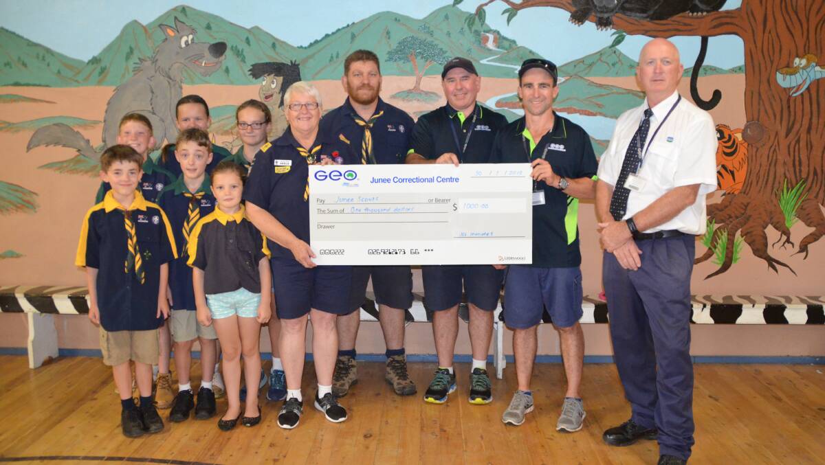 A HELPING HAND: The scouts receive a generous donation towards their jamboree fund from the inmates at Junee Correctional Centre. Picture: Supplied