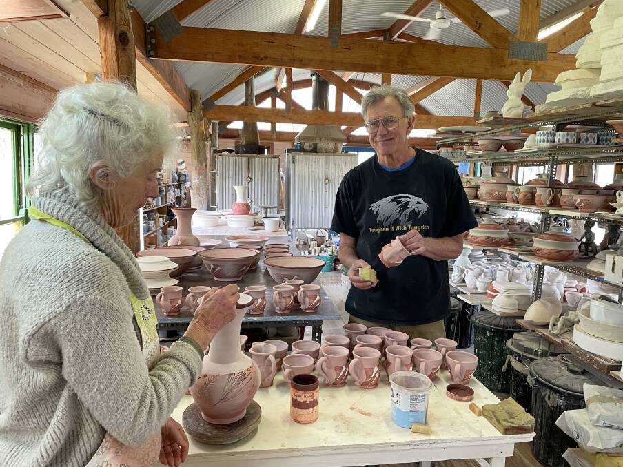 SANTA'S LITTLE HELPERS: Artisan potters Rick Hatch and Suzanne Forsyth Hatch in their studio, creating pots and wares to be sold in their pop-up shop in the lead up to Christmas. Photo: Supplied