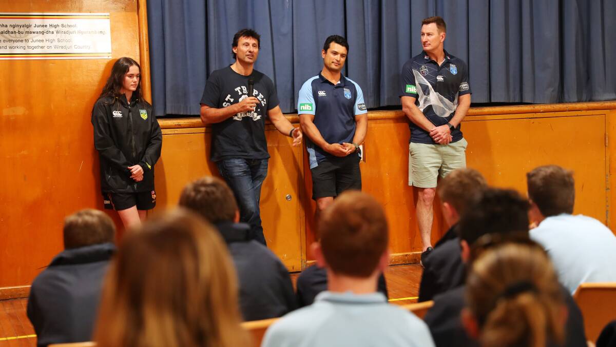 Tess Staines, Laurie Daley, Craig Wing and Steve Menzies addressing students at Junee High School on Friday.