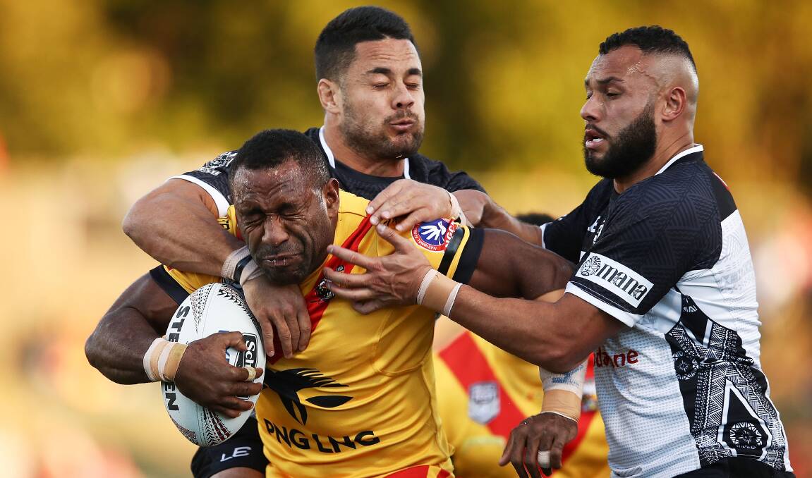 JUNEE BOUND: Thompson Teteh, pictured being tackled by Jarryd Hayne in the 2018 Pacific Test Invitational between Papua New Guinea and Fiji, has linked with the Diesels for next season. Picture: Getty Images