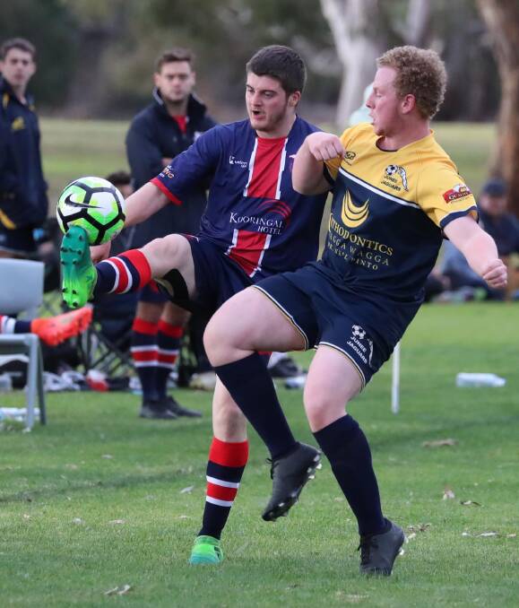 TIGHT CONTEST: Henwood Park's Dylan Lynch and Junee's Ben Cooke battle for the ball as they Hawks proved too strong at Rawlings Park on Sunday. Picture: Les Smith