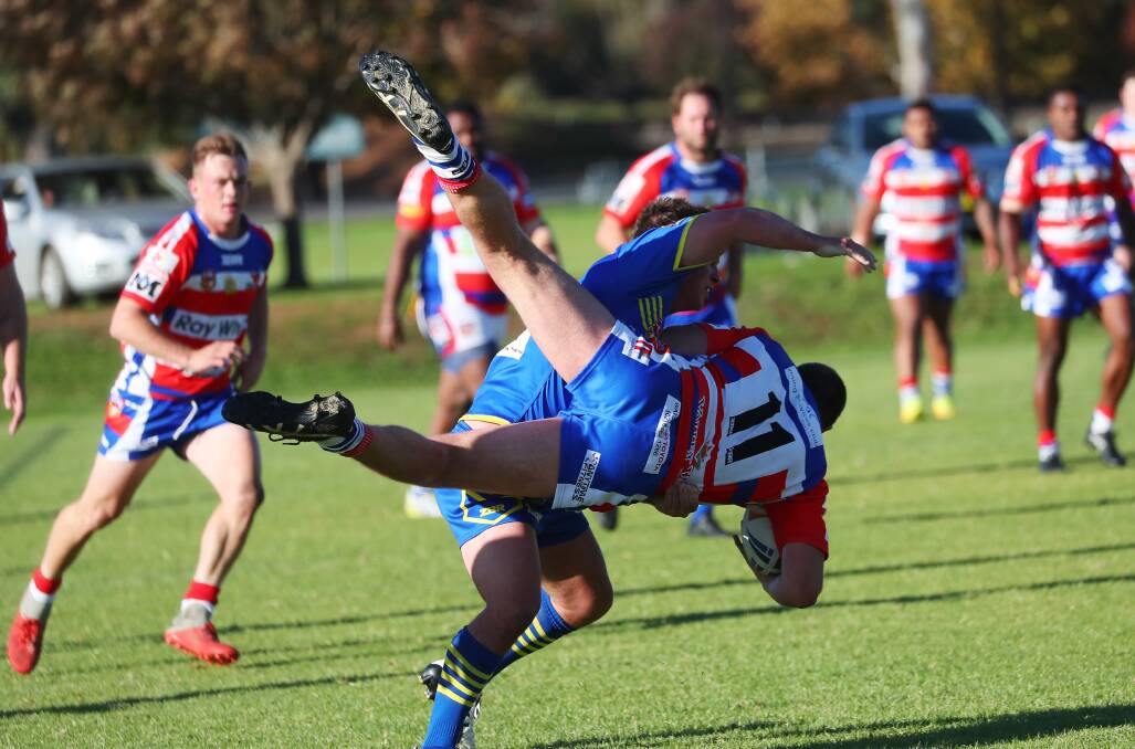 Trent Schubach sends Jayke Hogan to the ground at Laurie Daley Oval on Saturday.