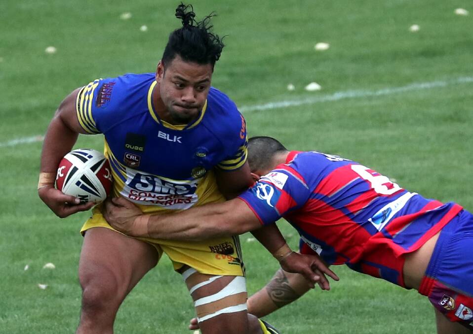 WRAPPED UP: Fale Malase can't avoid being tackled by Dana Ratu in Junee's win over Kangaroos to start the season at Equex Centre. Picture: Les Smith