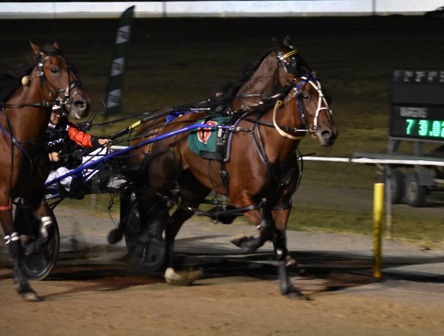 TIGHT FINISH: Rocking held off Grinning Punter and Roll One Over to win the Junee Pacers Cup on Saturday night. Picture: Courtney Rees