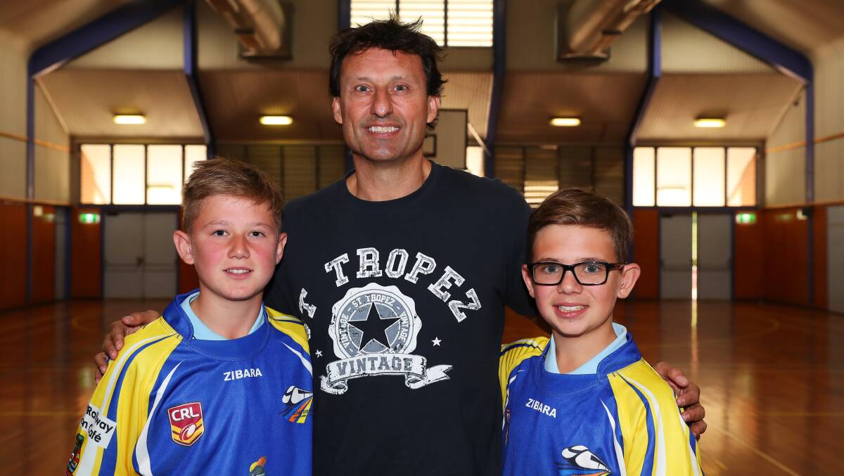 STAR ATTRACTION: Laurie Daley catches up with young Diesels Eli Crozier, 14, and Cooper Vanzanten, 12, during his visit on Friday. Picture: Emma Hillier