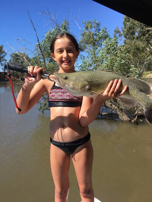 WELL DONE: Aimee George with her first legal cod, coming in at 59cm, from the Murrumbidgee. Pictures to craig@waggamarine.com.au.